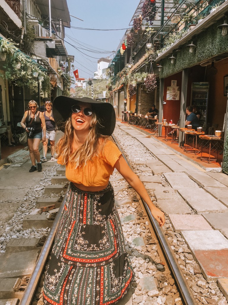 spellbound travels girl on train street hanoi vietnam