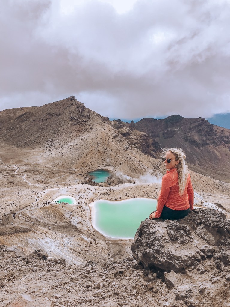 spellbound travels girl at top of tongariro crossing new zealand hike 