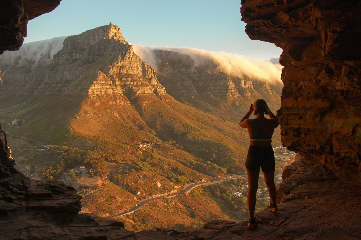 girl standing inside wally's cave cape town