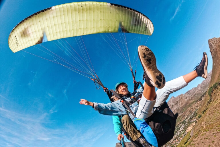 girl paragliding in Cape Town with a view of Lion's Head