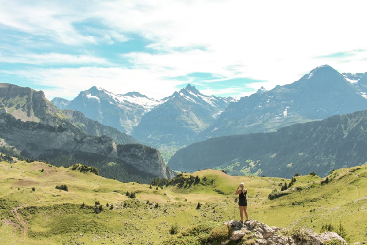 girl standing in the mountains in Switzerland