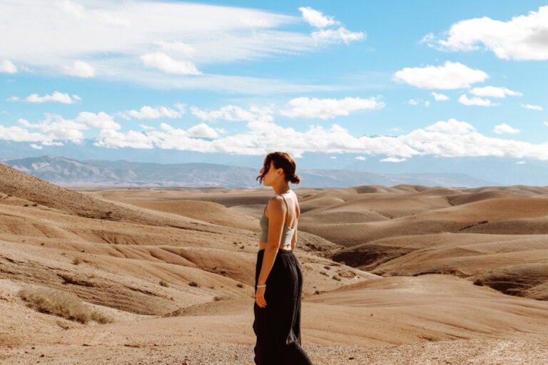 girl standing in the Agafay Desert near Marrakech, Morocco